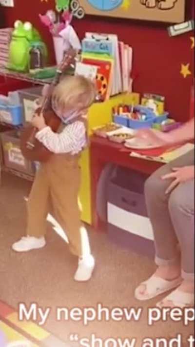 Little dude rocking out but edited with Van Halen