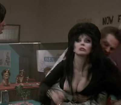 Cassandra Peterson's nip slip - Elvira: Mistress of the Dark (1988)