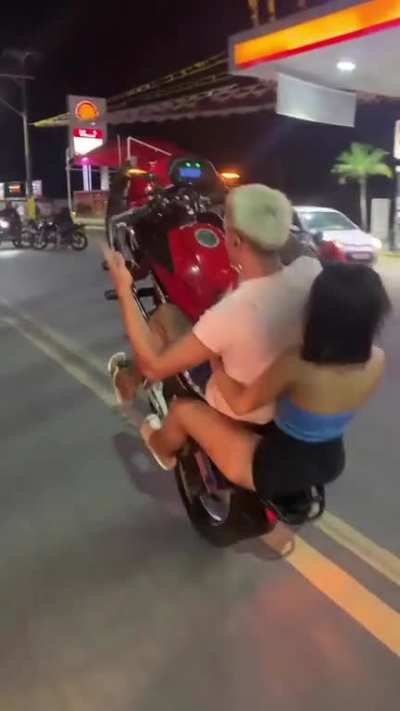 WCGW doing bike tricks with a passenger