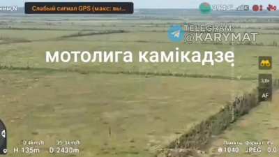 UA Pov: A Russian MT-LB loaded with explosives is being observed by a drone, 2 soldiers jump off the MT-LB before it reaches near a trench where it explodes.