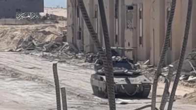 Two Hamas fighters filmed running up to IDF tank on wide open road in Rafah and planting explosives underneath the turret.