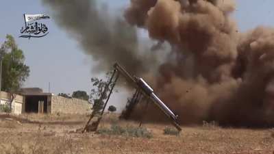 Syrian rebels (Sham Legion/Faylaq Sham) firing rockets during the offensive to break the Syrian army's siege of Aleppo in August 2016. Original title said these were aimed at the Aleppo artillery college.