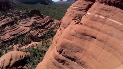 Bare mountain bike trail on the face of a cliff