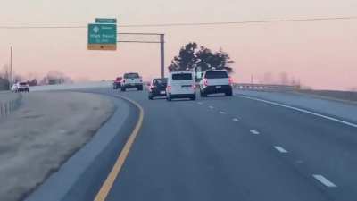 Van aggressively pursues car until the van runs the car off the road. The van immediately gets pulled over