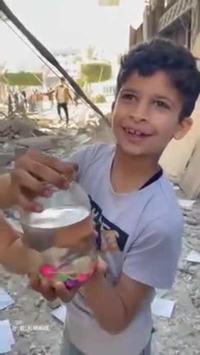 Two Gazan children are happy to report their fish has survived israeli bombing.