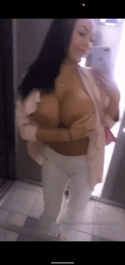 Nastya playing with her balloons in the elevator