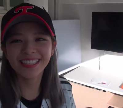 Jeongyeon - black & red baseball cap, white striped shirt, close up