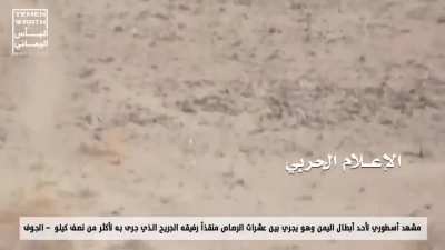 Yemeni man carrying someone while being shot at