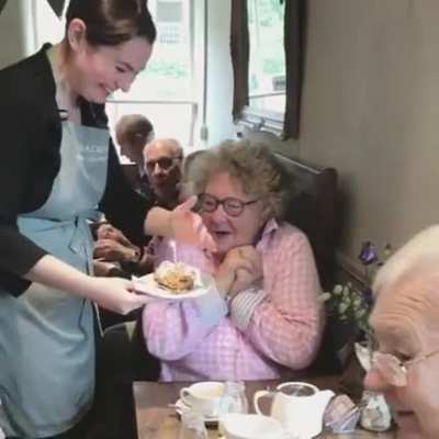 A regular customer's heartwarming reaction to a free cake on her birthday