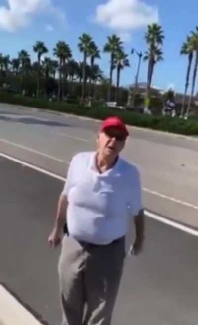Racist Trump supporter harrasses man peacefully protesting the xenophobic Texas voting restrictions backed by the GOP, but recieves a fist full of justice and equality instead