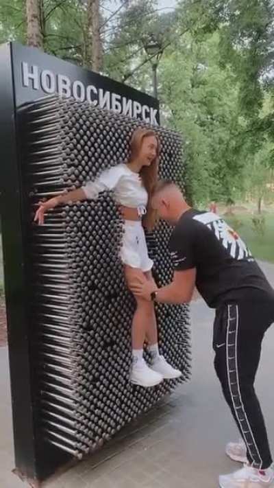 WOMAn MeRcILeSSLy puSHeD oNto WAlL oF SpikeS