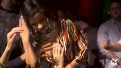Cardi giving out Handfulls