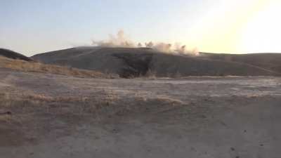 Iraqi cameramen capture a frantic battle with IS fighters in which gunship support is used danger close - Hawija, Iraq - 2018