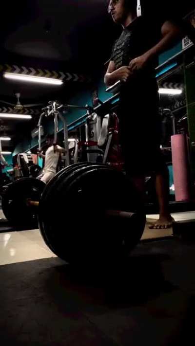 Lifting weights at the gym. 