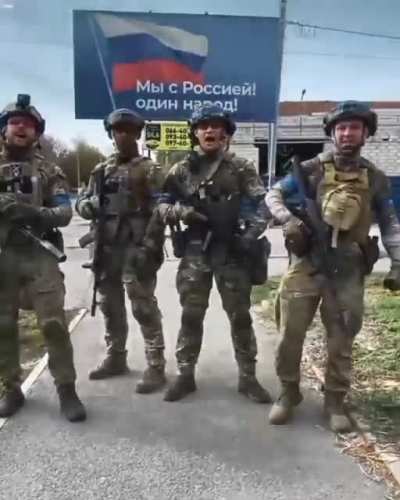 Ukrainian soldiers reply to Russia in front of billboard "We are with Russia.! One nation!": We have never been and will never be one nation, because you are a nation of slaves, and we are a nation of free people! Glory to Ukraine! Glory to the Heroes!