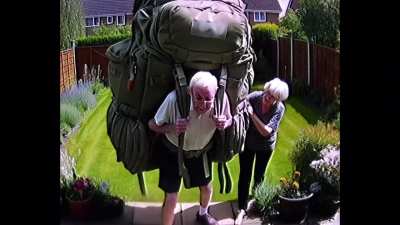 The elderly wearing large backpacks 
