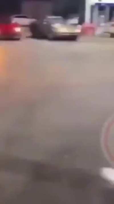 Woman gets jumped after throwing rock at car