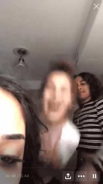 "Friend" lifts shirt