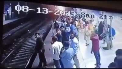 Indian man gropes woman and is smacked down onto the train tracks, visible death NSFL