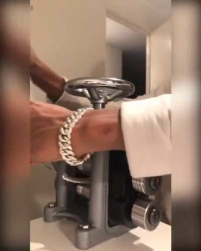 A silver smith doing some manly chains