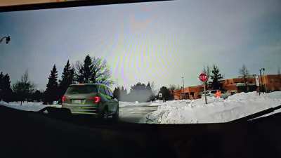 Looking for video showing a clear plate of the white suv that nearly hit the school crossing guard