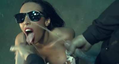 girl in sunglasses gets sprayed by two cocks simultaneously