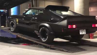 Watch a Mad Max Interceptor tribute car in Japan as it is unloaded into a garage.