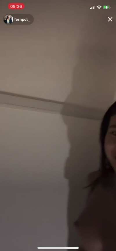 Topless Asian girl (accidentally) shows tits on live