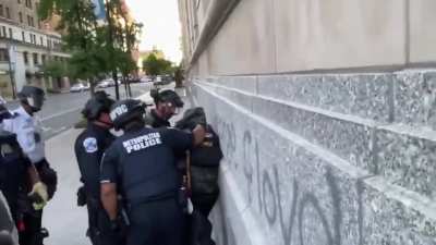 Protesters hand rioter over to police