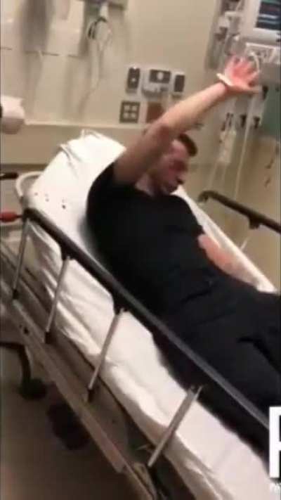 Two cops film themselves assaulting suicidal man in hospital bed.