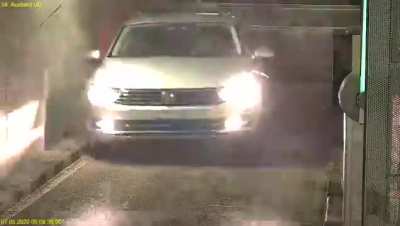 A car takes some hard knocks trying to enter a parking garage