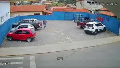 man crosses the street... but he doesn't look to one side