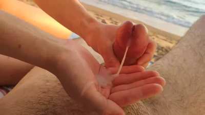 Making him cum on the beach