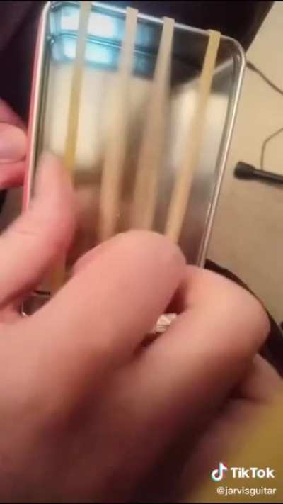 This rubber band instrument thing and her ability to play it