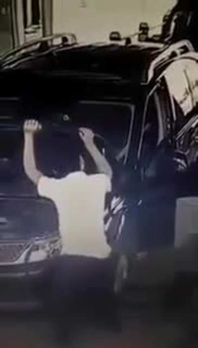 Closing a car hood.