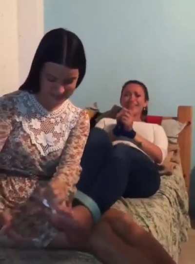 Latina girl tickles her friend's feet