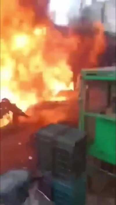 Flaming motorcycle explodes on people trying to put it out