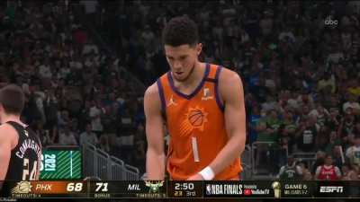 Jrue Holiday randomly steals the ball out of Devin Bookers hands as he&rsquo;s about to take a free throw