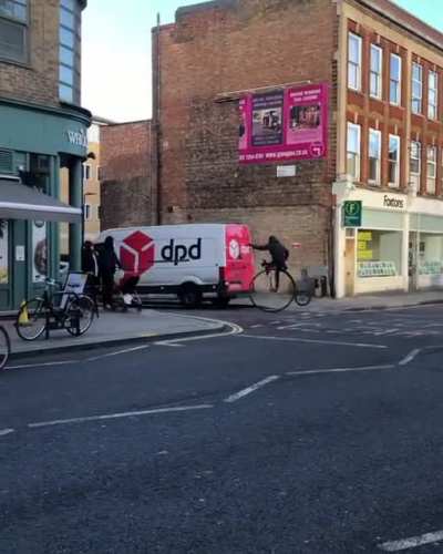 Just a hipster on a Penny Farthing in London