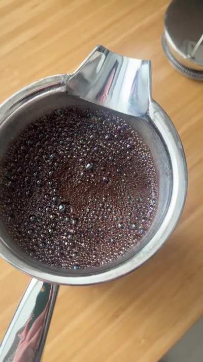 The bubbles on top of my pot of coffee become rainbow when I blow on them