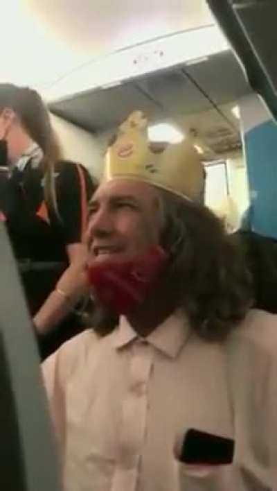 A guy wearing Burger King crown saying racial slurs on a plane