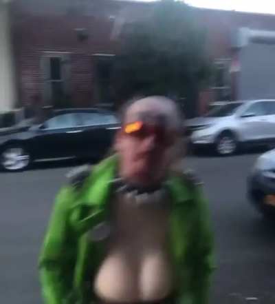 man with boobs shouting in public?