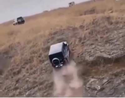 Vehicle drives up an almost completely vertical hill