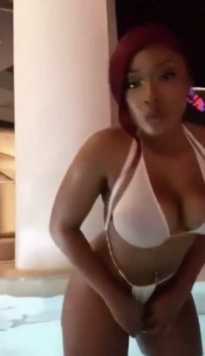 Megan Thee Stallion in a white thong bikini