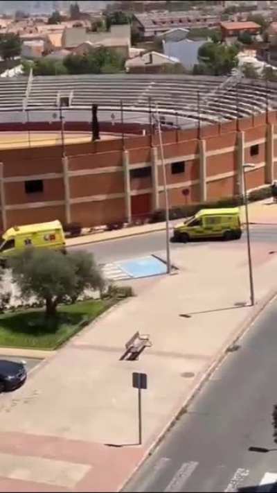 This individual throws stones at a medical helicopter trying to land to make an urgent transfer of a shooting patient to hospital in Madrid (Spain). The Civil Guard (Guardia Civil) has to escort the helicopter. The stone "thrower" apparently leaves withou