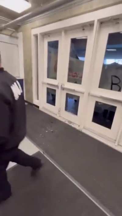 Protestors attempt to break into the University Credit Union Center during Charlie Kirk&rsquo;s speech