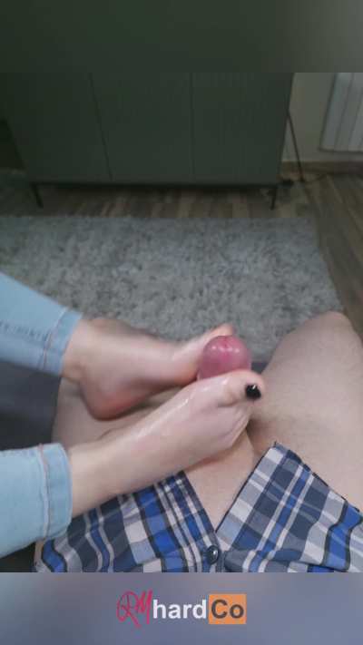 Making him shoot a big load with my tiny feet