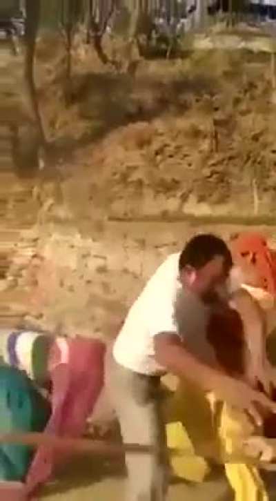 Man beats woman. Then other women come to her aid and beat up the man.
