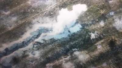 Ukrainian soldier runs into the path of a Russian FPV drone and is flung out of his path