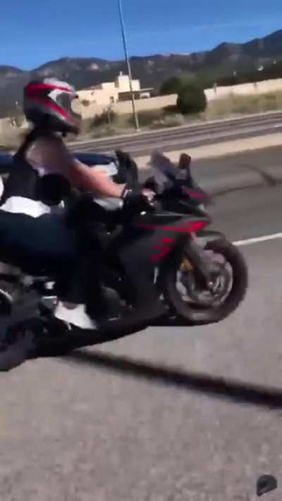 Cop Pulls Gun On Motorcycle for Wheelie